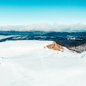 Scenic view of snow covered landscape against sky