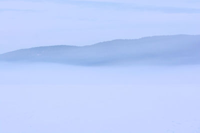 Close-up of frozen landscape against sky