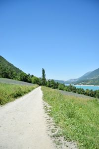 Surface level of road against clear sky