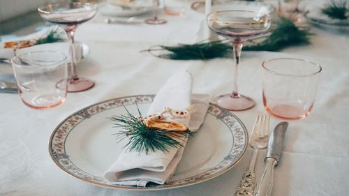 Glass of wine and glasses on table