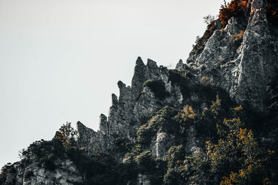 Low angle view of rock formation against sky