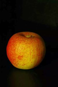 Close-up of lamp over black background