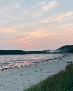 Scenic view of beach against sky during sunset