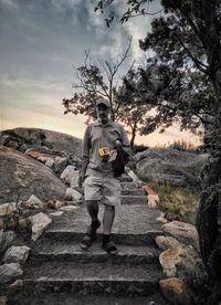 Full length of man standing on rock