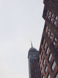 Low angle view of modern buildings against clear sky