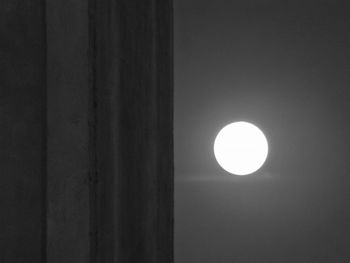 Low angle view of moon against sky at night