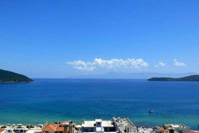 Scenic view of sea against blue sky