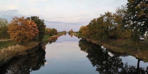 Scenic view of lake against sky during autumn