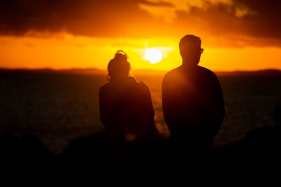 Silhouette people at sunset