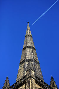 Low angle view of temple building against blue sky