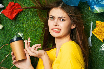 Portrait of woman holding coffee cup