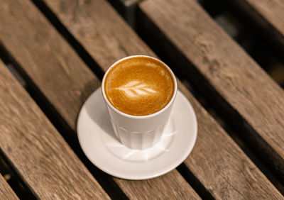 High angle view of coffee cup on table