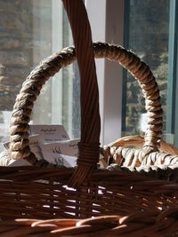 Close-up of wicker basket on table at home