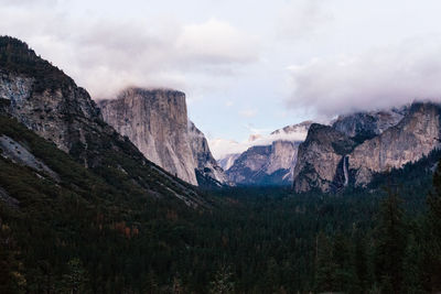 Scenic view of mountains against cloudy sky