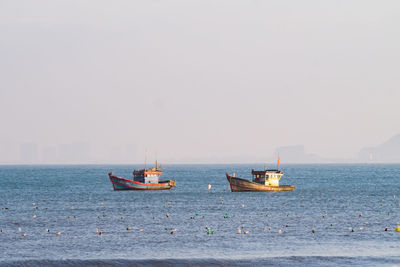 Boat in sea against clear sky