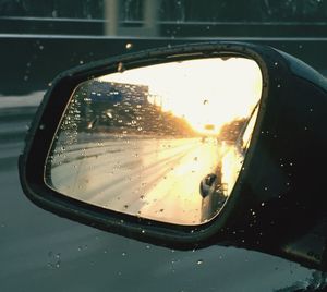 Reflection of car on side-view mirror