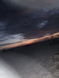 Scenic view of beach against sky during sunset