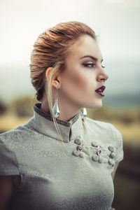 Portrait of young woman looking away