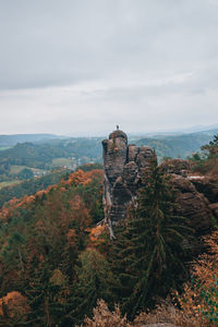 Castle on mountain against sky