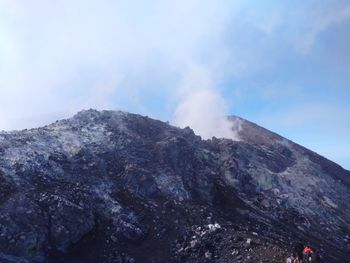 Scenic view of volcanic mountain against sky