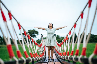 Full length of woman standing against the sky