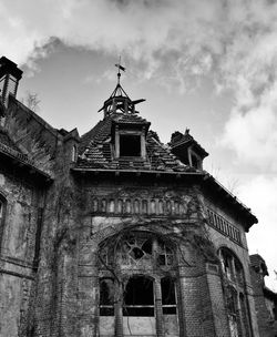 Low angle view of old building against sky