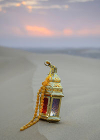 Close-up of christmas decorations on beach