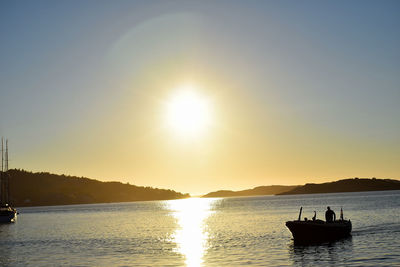 Scenic view of sea against clear sky during sunset