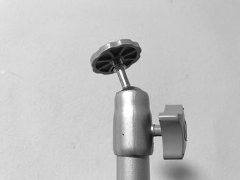 Close-up of electric lamp against wall