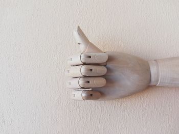 Close-up of human hand on wall