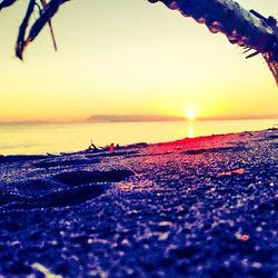 Scenic view of beach at sunset