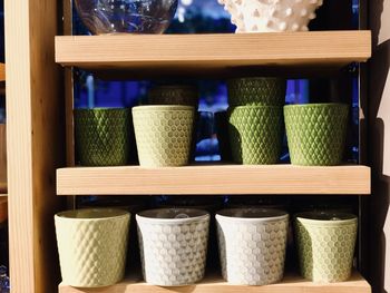 Colorful plant pots in rack