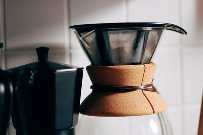 Close-up of coffee maker on table at home