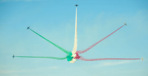 Low angle view of airplane flying in sky frecce tricolori in volo su lungomare di bari 8 maggio 2019