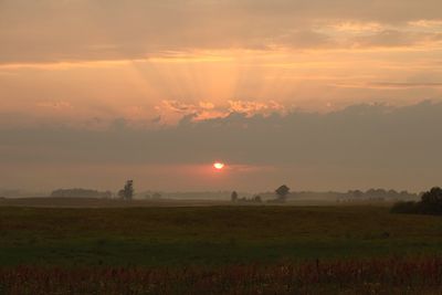 Scenic view of landscape at sunset
