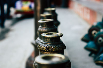 Close-up of religious bowls in temple