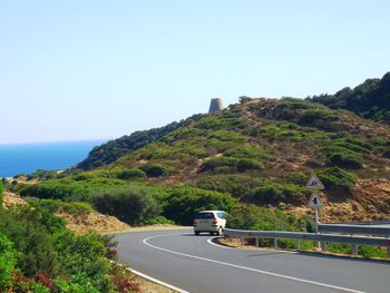 Country road leading towards mountains