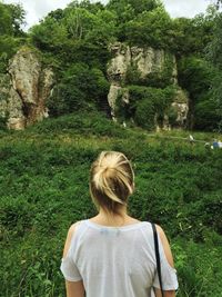 Rear view of woman looking at creswell crags