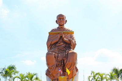Low angle view of statue against sky