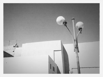 Low angle view of street light against sky