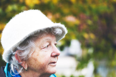 Close-up portrait of man looking away outdoors