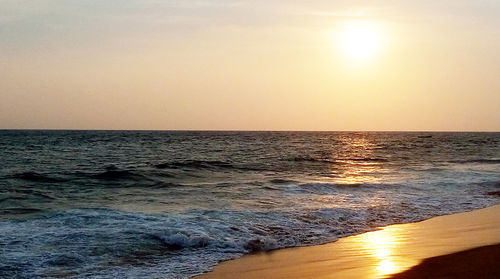 Scenic view of sea at sunset