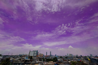 High angle view of town against cloudy sky