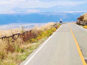 Country road leading towards mountains