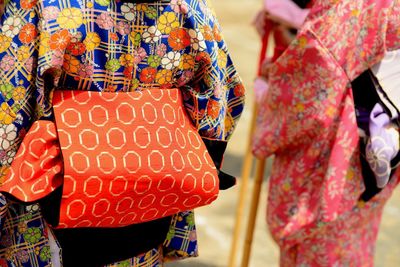 Rear view of women in traditional clothing