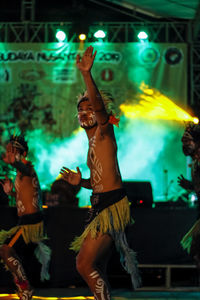 Group of people dancing at nightclub