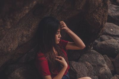 Full length of young woman on rock
