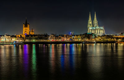 Illuminated buildings at waterfront