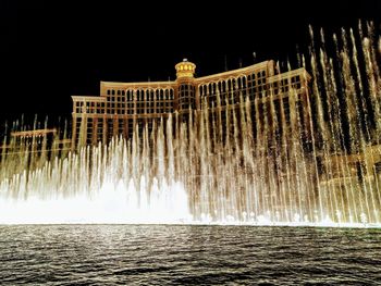 Low angle view of fountain at night