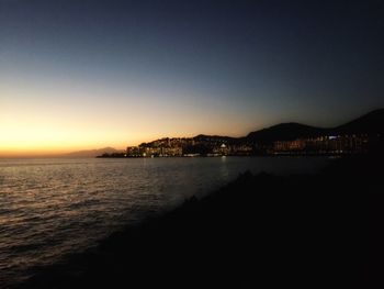 Scenic view of calm sea at sunset